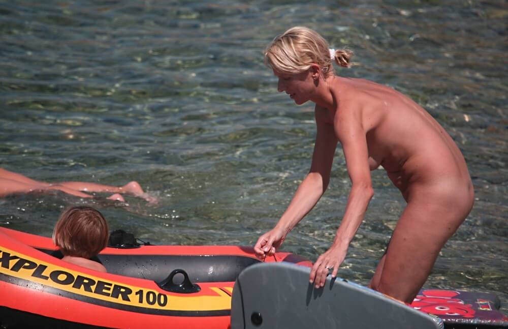 Red Boating for Two Nudists pics - Nudity is seen as a natural part of life among nudists