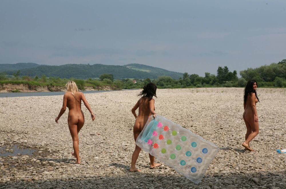 Naturist Park Floating On River photos - Naturists live freely and naturally