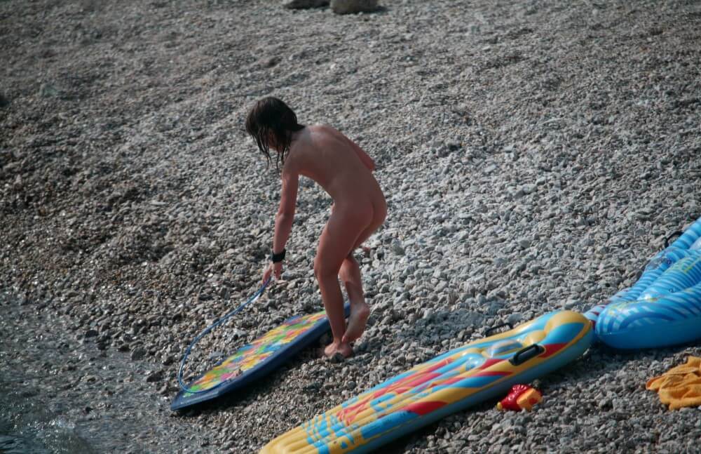 Naturist Surf Board Glides pics - Living freely and naturally is the dream of naturism and nudism advocates