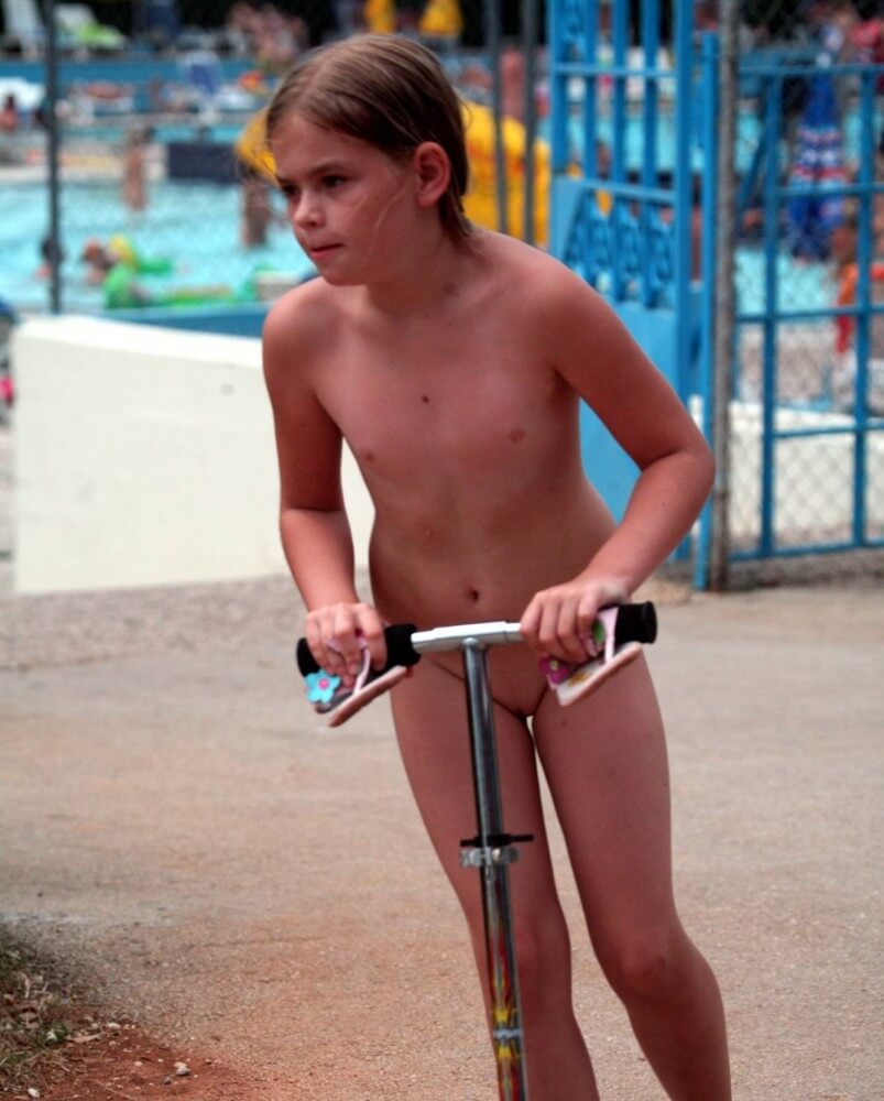 Pool-Side Naturist Scooter pics - Spectators are permitted to be naked
