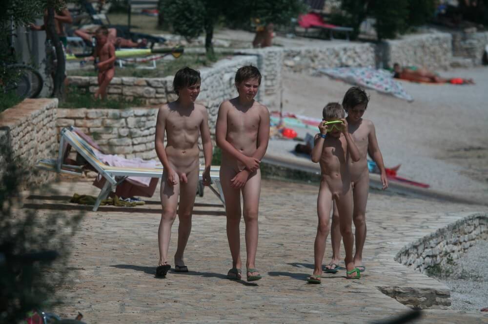 Shore walking nude - Nudity is perceived as a natural way of life